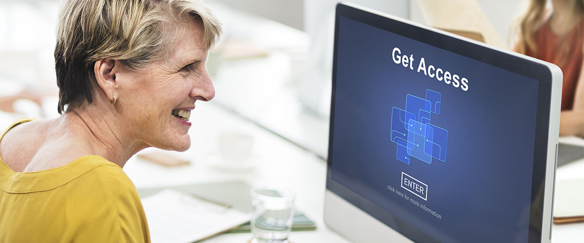 Visually impaired woman getting access to desktop computer