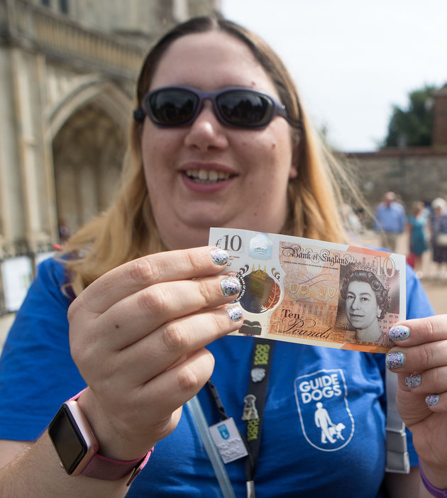 Jemma Brown, from Guide Dogs, tests the feature on the new £10 note